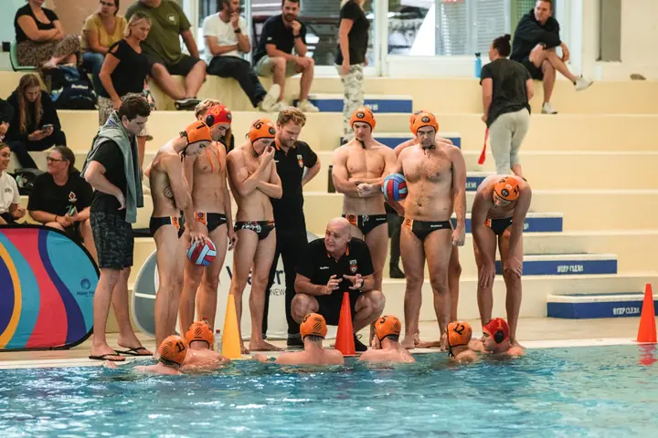 Men's AWL team huddle